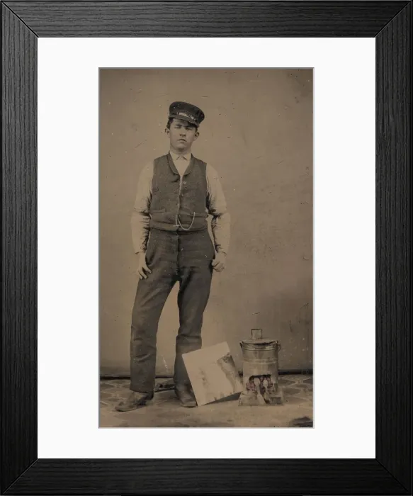 Framed Print : Tinsmith with Coal Heater and Sheet of Tin, 1870s-80s. Creator: Unknown Framed Print : Tinsmith with Coal Heater and Sheet of Tin, 1870s-80s. Creator: Unknown