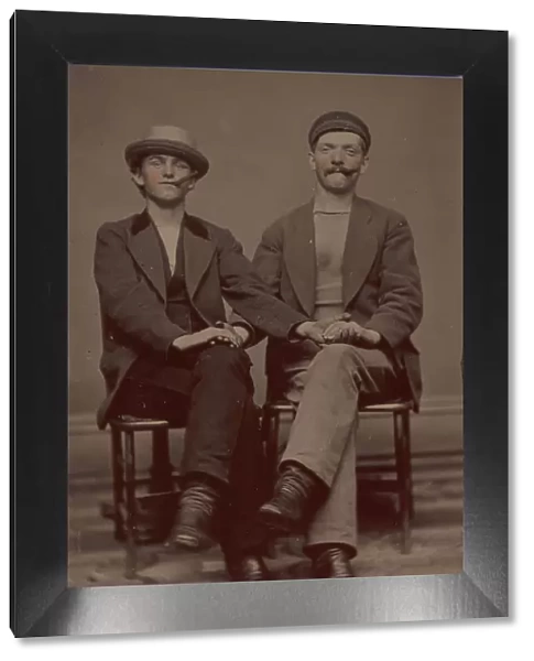 Two Seated Young Men Holding Hands, 1880s. Creator: Unknown