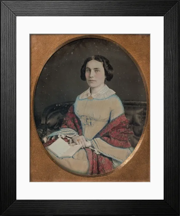 Framed Print : Seated Young Woman Wearing a Shawl, Holding an Open Book in her Lap, 1850s Framed Print : Seated Young Woman Wearing a Shawl, Holding an Open Book in her Lap, 1850s