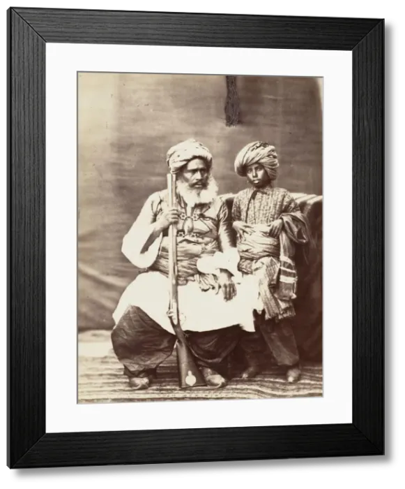 Framed Print : Turbaned Man Holding Rifle with Boy Alongside, 1860s. Creator: Unknown Framed Print : Turbaned Man Holding Rifle with Boy Alongside, 1860s. Creator: Unknown