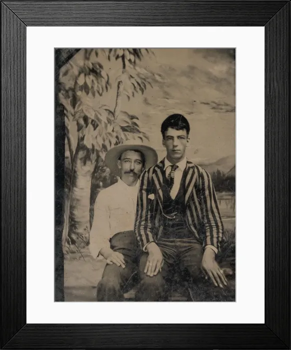 Framed Print : Young Man in a Striped Jacket, Sitting on the Lap of Another Man in Front of Painted Framed Print : Young Man in a Striped Jacket, Sitting on the Lap of Another Man in Front of Painted