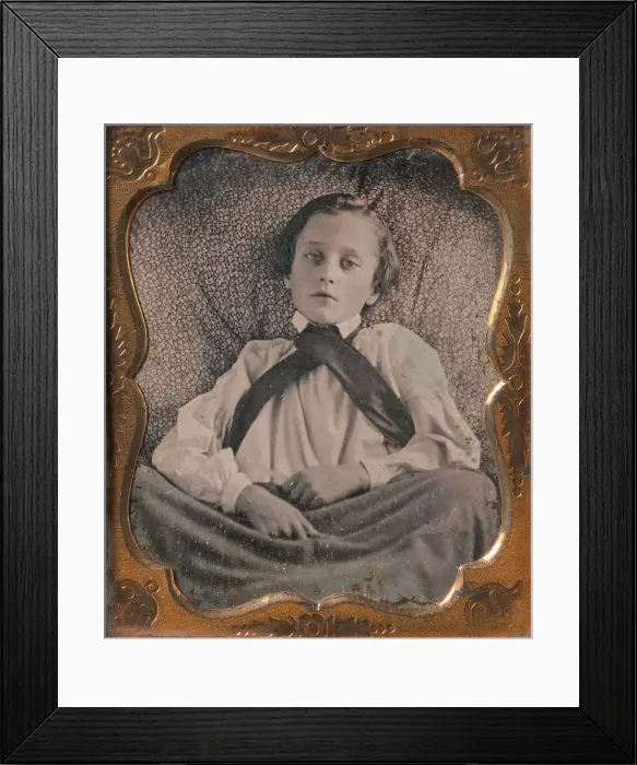 Framed Print : Boy Seated Cross-legged, Partially Covered by Blanket, Leaning Against Cushion, 1850s Framed Print : Boy Seated Cross-legged, Partially Covered by Blanket, Leaning Against Cushion, 1850s