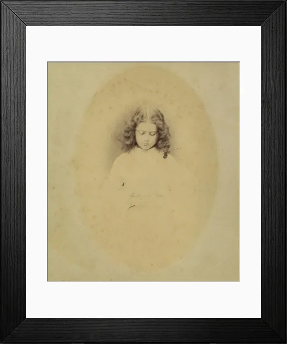 Framed Print : Edith Liddell Seated Beside a Vase of Foxgloves, 1860. Creator: Lewis Carroll