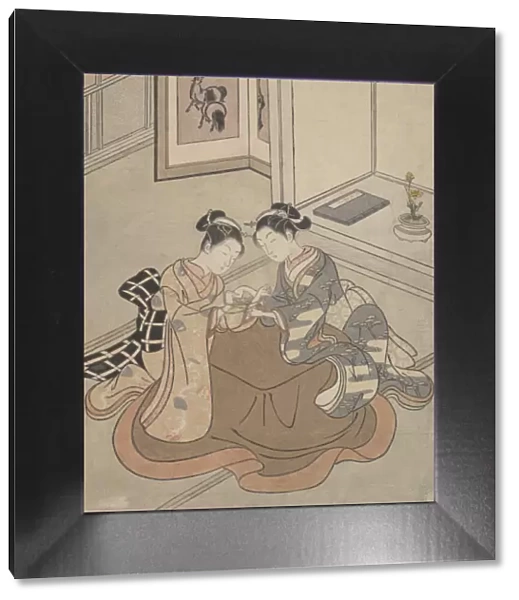 Two Young Women Seated by a Kotatsu Playing Cats Cradle, ca. 1765. ca. 1765