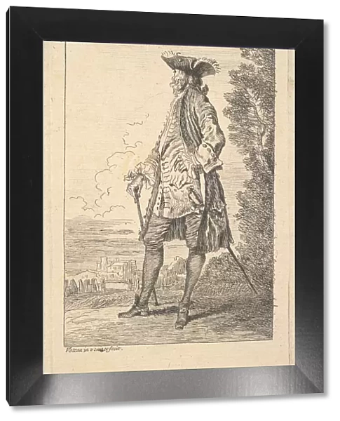 Man walking and carrying a cane in his right hand, shown in three-quarters view with h