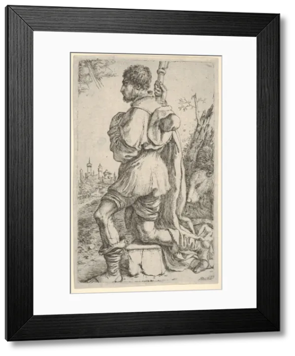 Framed Print : Saint Roch, kneeling on a stone, seen from the side with his dog behind him and a towns Framed Print : Saint Roch, kneeling on a stone, seen from the side with his dog behind him and a towns