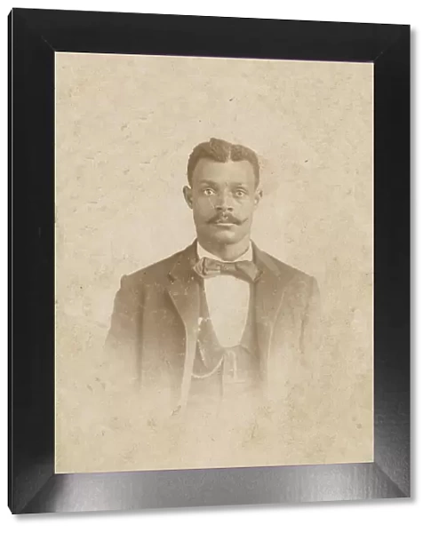 Photograph of a man in a suit, vest and necktie, 1880s - 1900. Creator: J. W. Taylor