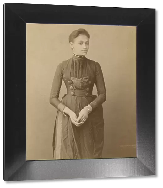 Cabinet card of a woman, 1885-1892. Creator: William J. Kuebler