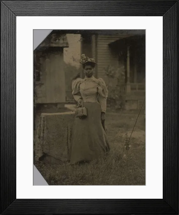 Framed Print : Tintype of a woman wearing a dress with hat and bag, 1890s. Creator: Unknown Framed Print : Tintype of a woman wearing a dress with hat and bag, 1890s. Creator: Unknown