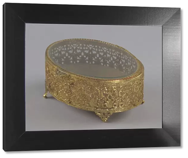 Gold metal scrollwork jewelry box from Maes Millinery Shop, 1941-1994. Creator: Unknown