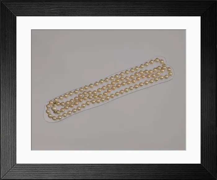 Framed Print : Pearl necklace from Maes Millinery Shop, 1941-1994. Creator: Unknown
