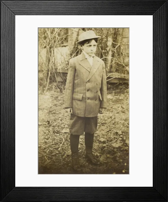 Framed Print : Photographic postcard of a boy wearing a double-breasted jacket and breeches Framed Print : Photographic postcard of a boy wearing a double-breasted jacket and breeches