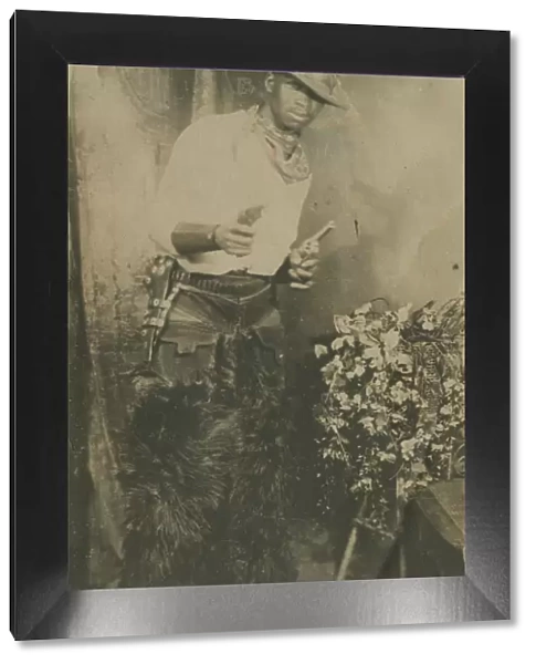 Photograph portrait of a man dressed as a cowboy, early 20th century. Creator: Unknown