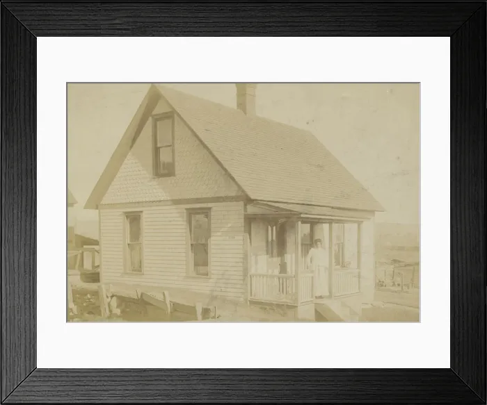 Framed Print : Photograph of a woman standing on the porch of a house, early 20th century Framed Print : Photograph of a woman standing on the porch of a house, early 20th century