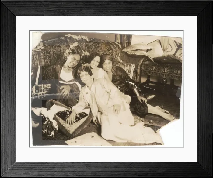 Framed Print : Photographic print of 4 women sitting in front of a sofa, early 20th century Framed Print : Photographic print of 4 women sitting in front of a sofa, early 20th century