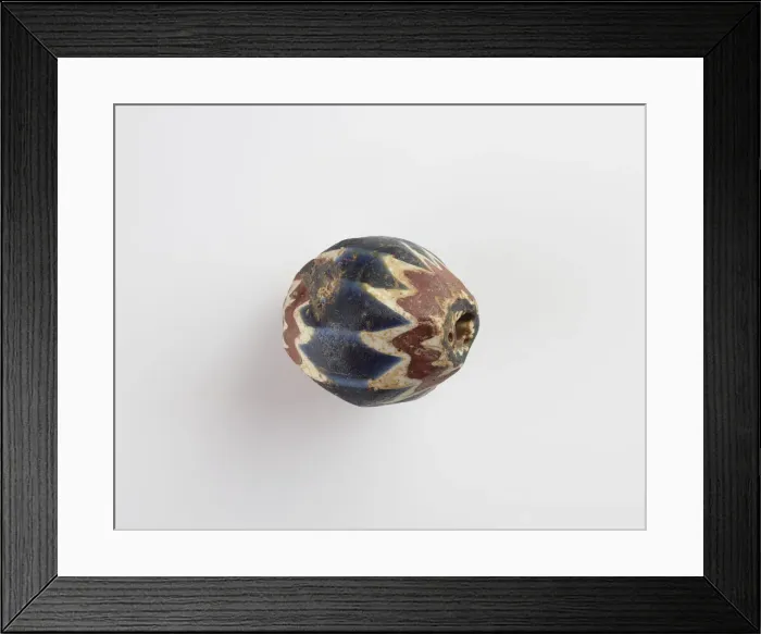 Framed Print : Bead, egg-shaped, with chamfered sides. Two sides chipped away, 13th-14th centuries Framed Print : Bead, egg-shaped, with chamfered sides. Two sides chipped away, 13th-14th centuries
