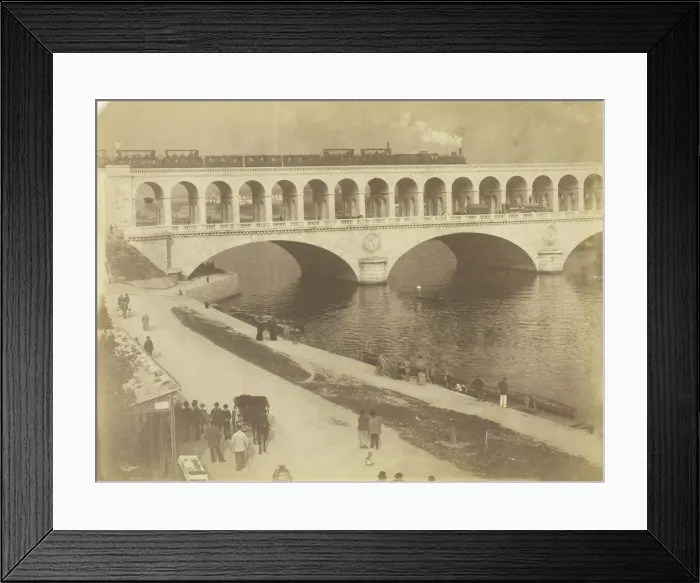 Framed Print : Untitled, 1870  /  79. [Steam locomotive on the upper level of a bridge... ]. Creator: Unknown