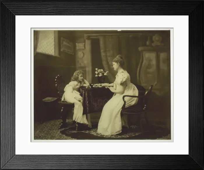 Framed Print : Woman and Child Playing Dominoes at Table, c. 1898. Creator: Unknown Framed Print : Woman and Child Playing Dominoes at Table, c. 1898. Creator: Unknown