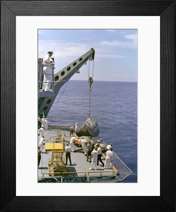 Framed Print : Gemini 5 capsule hoisted onboard recovery ship, 1965. Creator: NASA Framed Print : Gemini 5 capsule hoisted onboard recovery ship, 1965. Creator: NASA