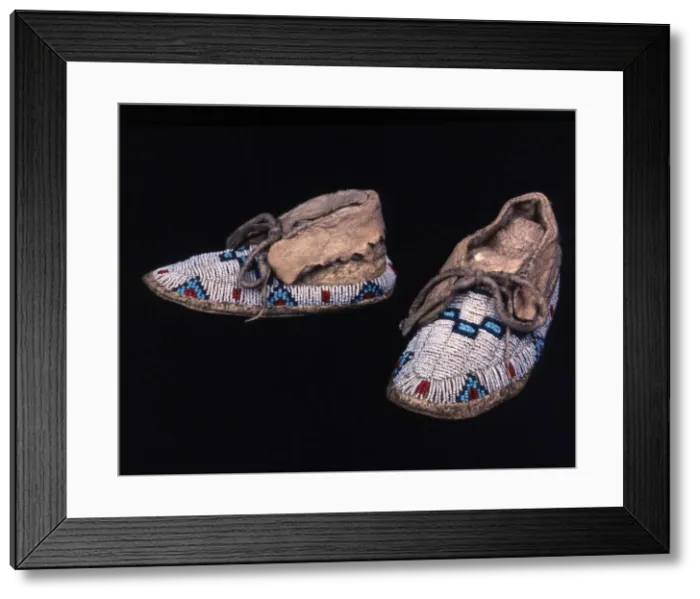 Framed Print : Pair of childs moccasins, Plains, possibly Sioux, c. 1885. Creator: Unknown Framed Print : Pair of childs moccasins, Plains, possibly Sioux, c. 1885. Creator: Unknown