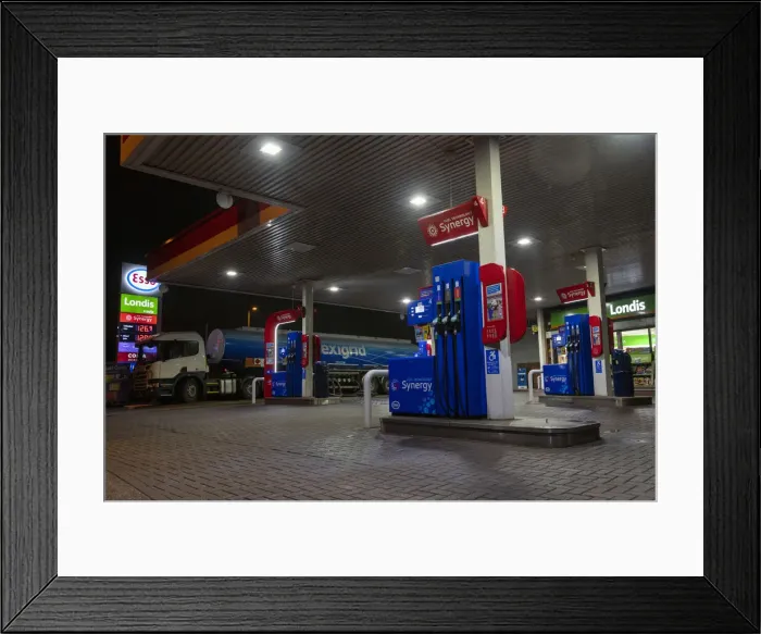 Framed Print : Esso petrol station forecourt with tanker delivering fuel, 2020. Creator: Tim Woodcock Framed Print : Esso petrol station forecourt with tanker delivering fuel, 2020. Creator: Tim Woodcock