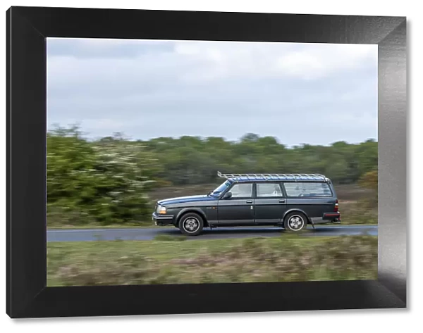 Volvo 244 Estate driving in New Forest, 2012. Creator: Tim Woodcock