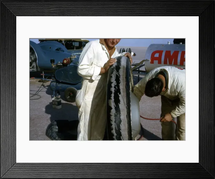Framed Print : Mechanics inflating Bluebird CN7 tyre for World Land Speed Record attempt, Lake Eyre