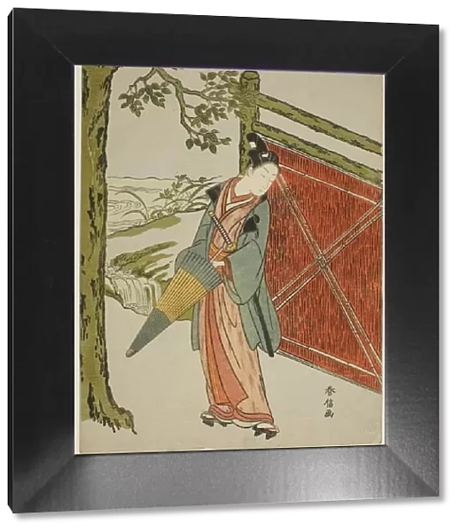 Young Man Holding Umbrella Beside a Fence, c. 1767  /  68. Creator: Suzuki Harunobu