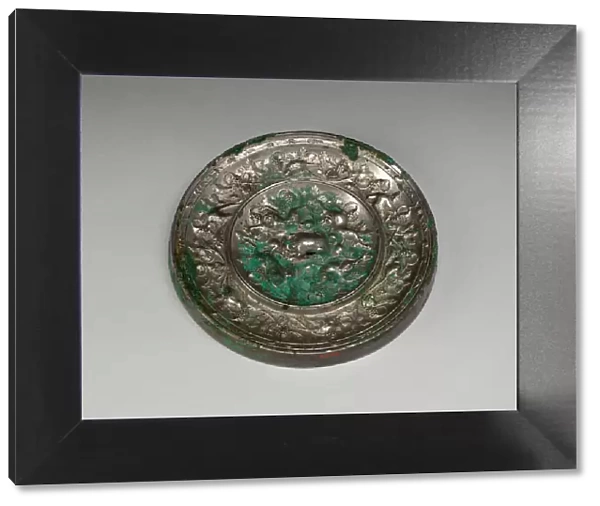 Mirror with 'Lion and Grapevine'Design, Tang dynasty (A. D)