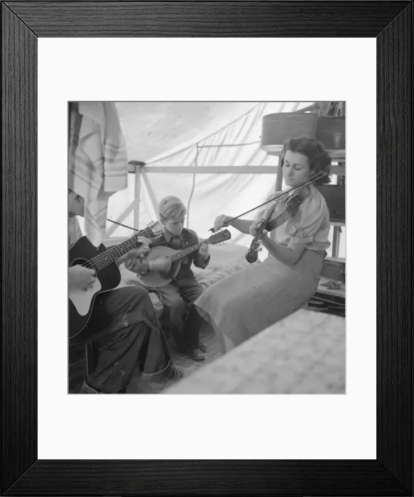 Framed Print : Migrant family from Arkansas playing hill-billy songs, FSA... migratory camp, Calipatria, CA, 1939. Creator: Dorothea Lange Framed Print : Migrant family from Arkansas playing hill-billy songs, FSA... migratory camp, Calipatria, CA, 1939. Creator: Dorothea Lange