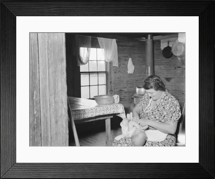 Framed Print : Wife of tobacco sharecropper bathing baby in kitchen, Person County, North Carolina, 1939. Creator: Dorothea Lange Framed Print : Wife of tobacco sharecropper bathing baby in kitchen, Person County, North Carolina, 1939. Creator: Dorothea Lange