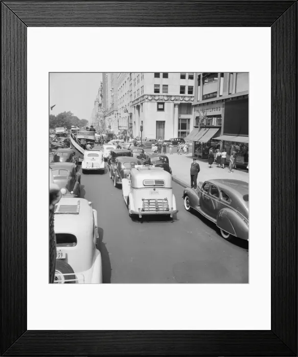 Framed Print : Traffic on Fifth Avenue approaching 57th Street on a summer afternoon, New York City, 1939. Creator: Dorothea Lange Framed Print : Traffic on Fifth Avenue approaching 57th Street on a summer afternoon, New York City, 1939. Creator: Dorothea Lange