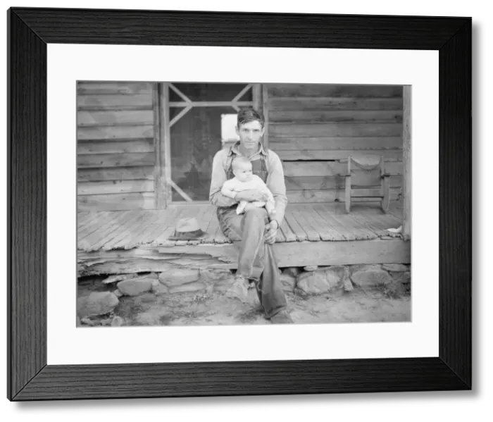Framed Print : Mr. Whitfield, tobacco sharecropper, with baby on front porch, North Carolina, Person County, 1939. Creator: Dorothea Lange Framed Print : Mr. Whitfield, tobacco sharecropper, with baby on front porch, North Carolina, Person County, 1939. Creator: Dorothea Lange