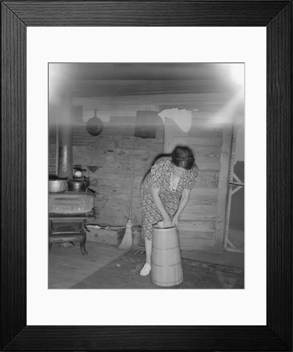 Framed Print : Wife of tobacco sharecropper cleaning butter churn, Person County, North Carolina, 1939. Creator: Dorothea Lange Framed Print : Wife of tobacco sharecropper cleaning butter churn, Person County, North Carolina, 1939. Creator: Dorothea Lange