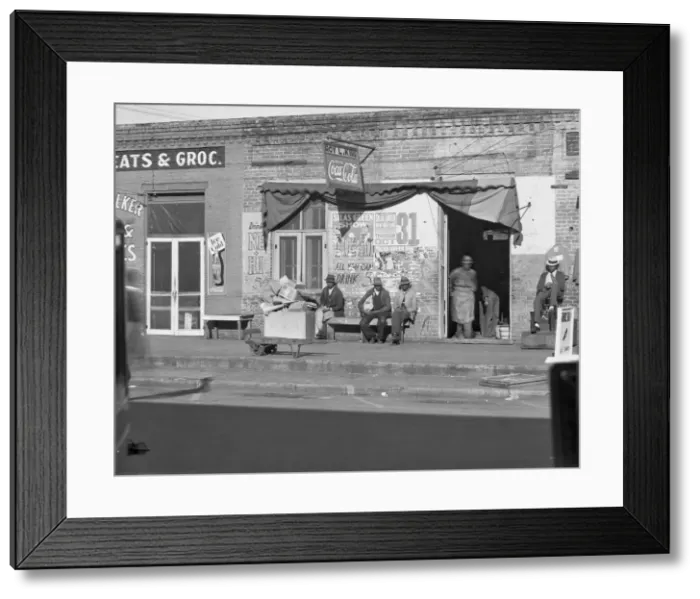 Framed Print : Sidewalk scene in Selma, Alabama, 1935. Creator: Walker Evans Framed Print : Sidewalk scene in Selma, Alabama, 1935. Creator: Walker Evans