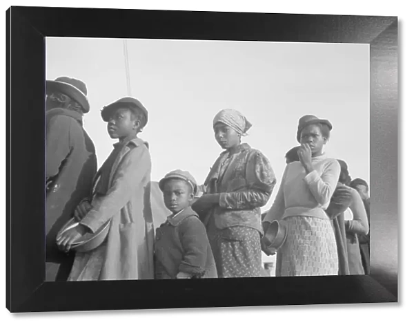 Negroes in the lineup for food at meal time in the camp for flood... Forrest City, Arkansas, 1937. Creator: Walker Evans