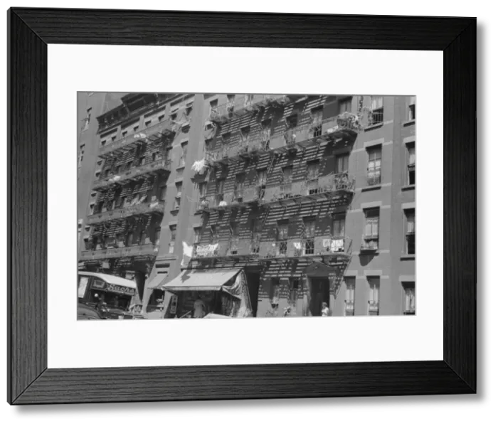 Framed Print : House fronts, 61st Street between 1st and 3rd Avenues, New York, 1938. Creator: Walker Evans Framed Print : House fronts, 61st Street between 1st and 3rd Avenues, New York, 1938. Creator: Walker Evans