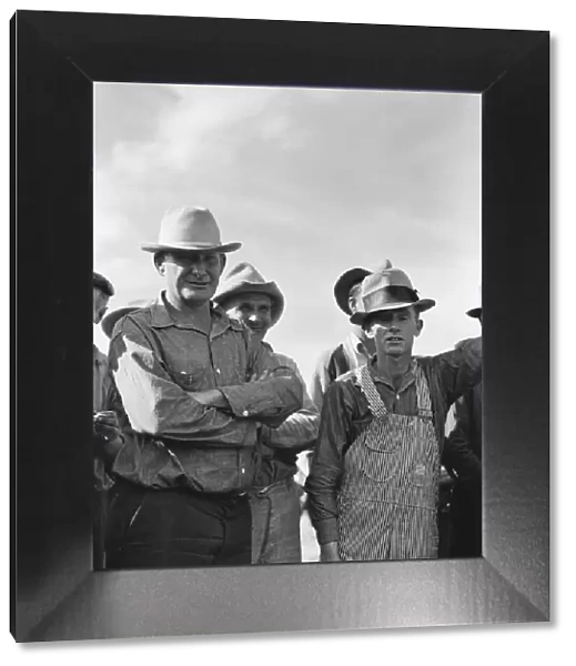 Watching ball game, Shafter camp for migrants, California, 1938. Creator: Dorothea Lange