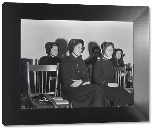 Visiting lassies sit on rostrom, Salvation Army, San Francisco, California, 1939. Creator: Dorothea Lange