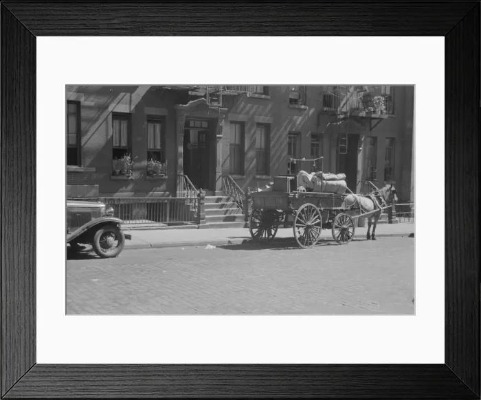 Framed Print : A tenant is moving on horse-drawn wagon, 61st Street between 1st and 3rd Avenues, New York, 1938. Creator: Walker Evans Framed Print : A tenant is moving on horse-drawn wagon, 61st Street between 1st and 3rd Avenues, New York, 1938. Creator: Walker Evans