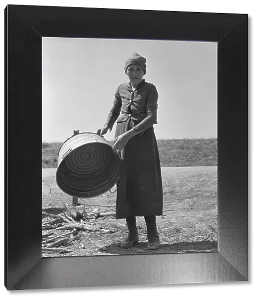 A grandmother in a contractors camp, Stanislaus County, California, 1939. Creator: Dorothea Lange