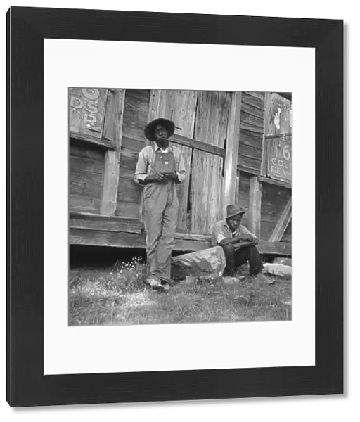 Tenant farmer and friend, Chatham County, North Carolina, 1939. Creator: Dorothea Lange