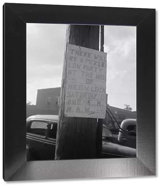 Sign tacked to pole near the post office, Main street, Pittsboro, North Carolina, 1939. Creator: Dorothea Lange