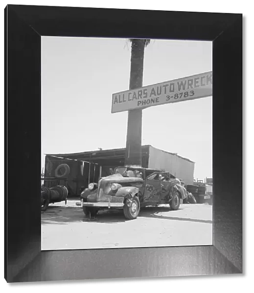 Used car lots and auto wrecking establishments, U. S. 99, Near Tulare, California, 1939. Creator: Dorothea Lange