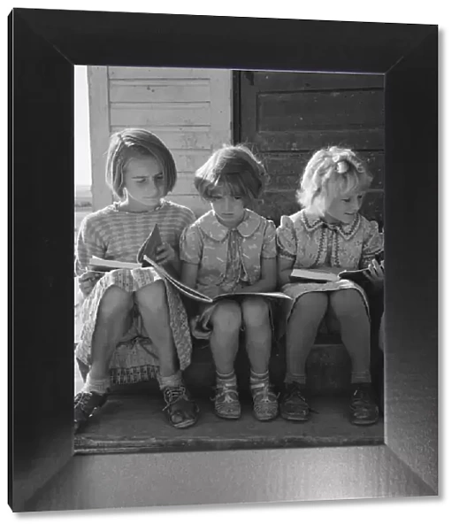 Girls of Lincoln Bench School study their reading lesson, near Ontario, Malheur County, Oregon, 1939 Creator: Dorothea Lange
