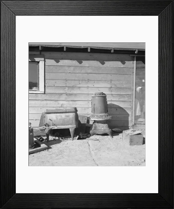 Framed Print : Stoves outside the Browning house being repaired for winter use, Dead Ox Flat, Oregon, 1939. Creator: Dorothea Lange Framed Print : Stoves outside the Browning house being repaired for winter use, Dead Ox Flat, Oregon, 1939. Creator: Dorothea Lange