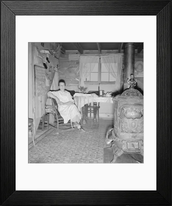 Framed Print : Mrs. Hull and corner of her one-room basement dugout, Dead Ox Flat, Malheur County, Oregon, 1939. Creator: Dorothea Lange