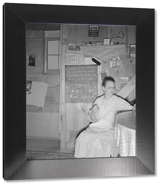 Mrs. Hull in one-room dugout basement home, Dead Ox Flat, Malheur County, Oregon, 1939. Creator: Dorothea Lange