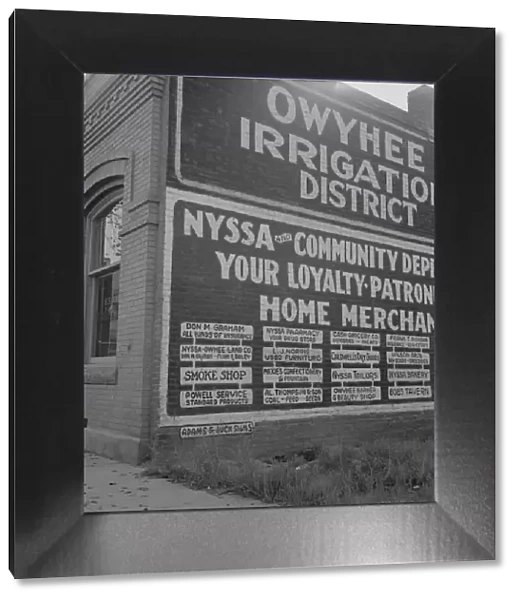 Sign on old bank building which now houses office of Bureau... Nyssa, Malheur County, Oregon, 1939. Creator: Dorothea Lange
