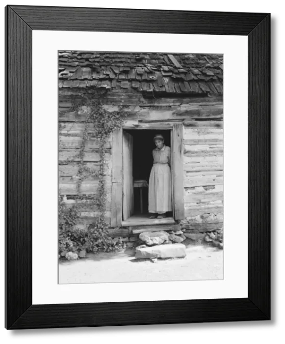 Framed Print : Caroline Atwater standing in the kitchen doorway of... log house, North Carolina, 1939. Creator: Dorothea Lange Framed Print : Caroline Atwater standing in the kitchen doorway of... log house, North Carolina, 1939. Creator: Dorothea Lange